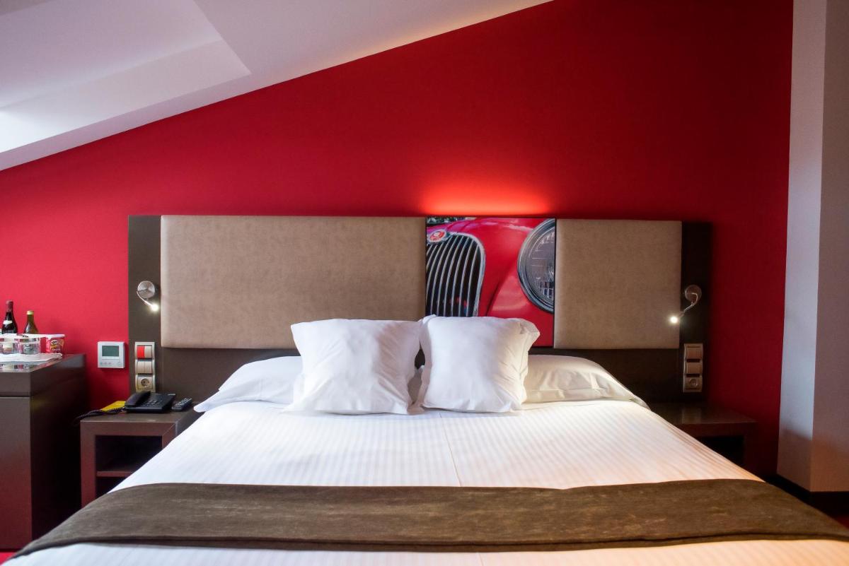 Cama o camas de una habitación en Costa Esmeralda Suites