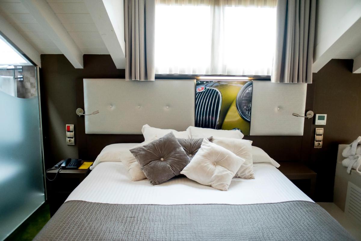 Cama o camas de una habitación en Costa Esmeralda Suites