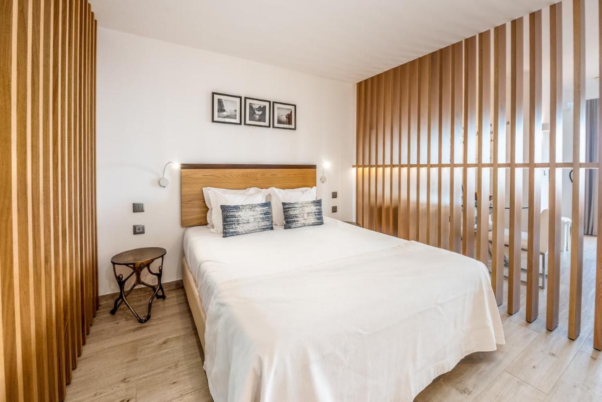 Uma cama ou camas num quarto em Estrela da Luz Resort