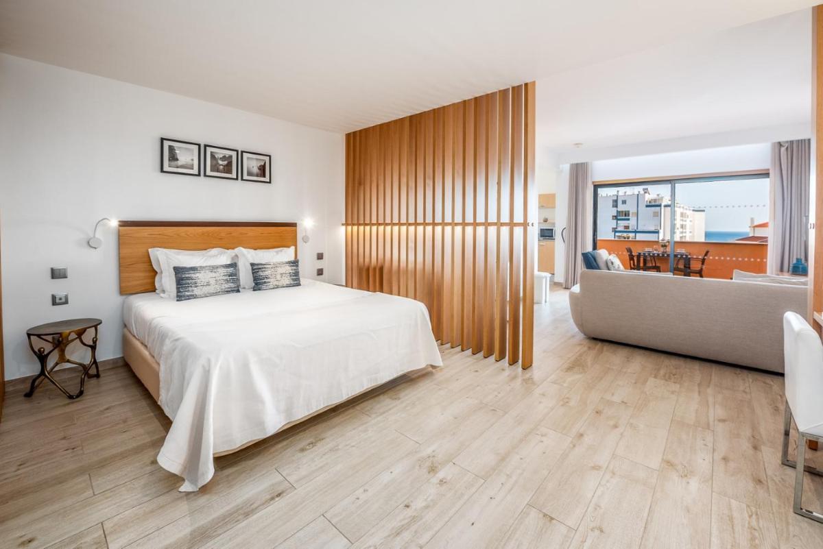 Uma cama ou camas num quarto em Estrela da Luz Resort
