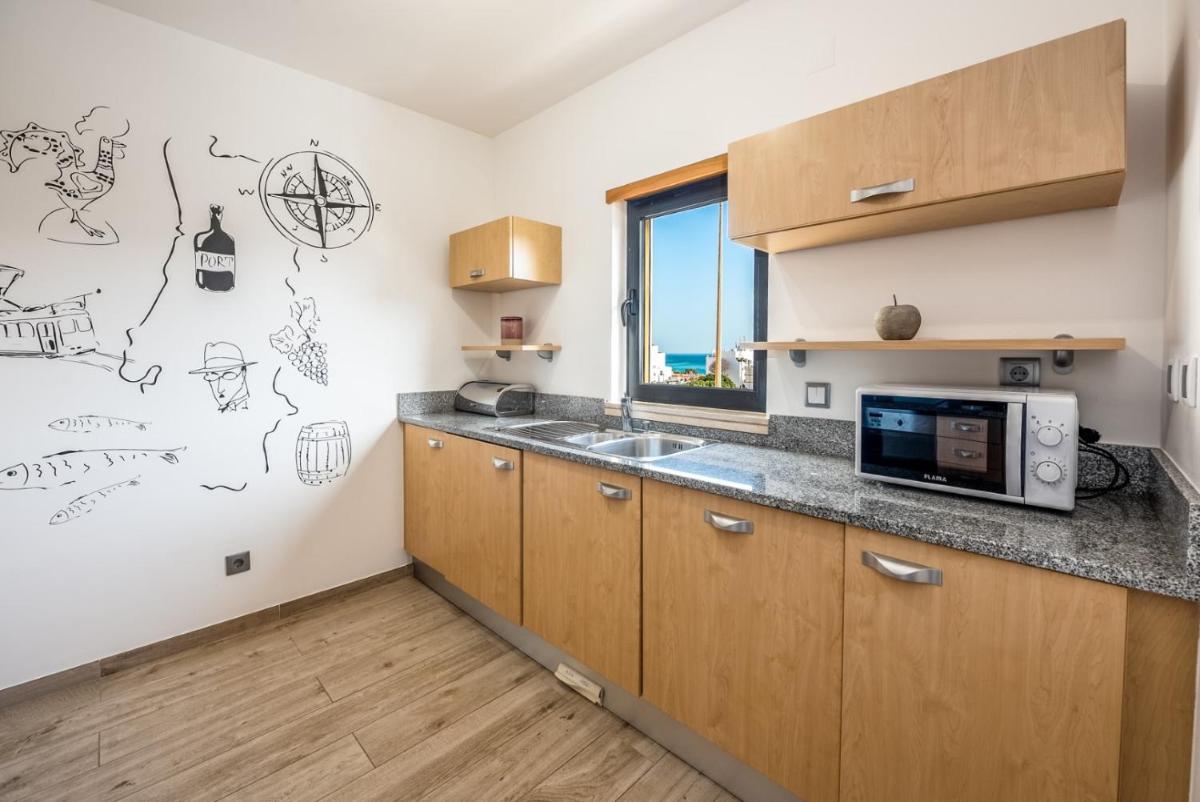 A cozinha ou kitchenette de Estrela da Luz Resort