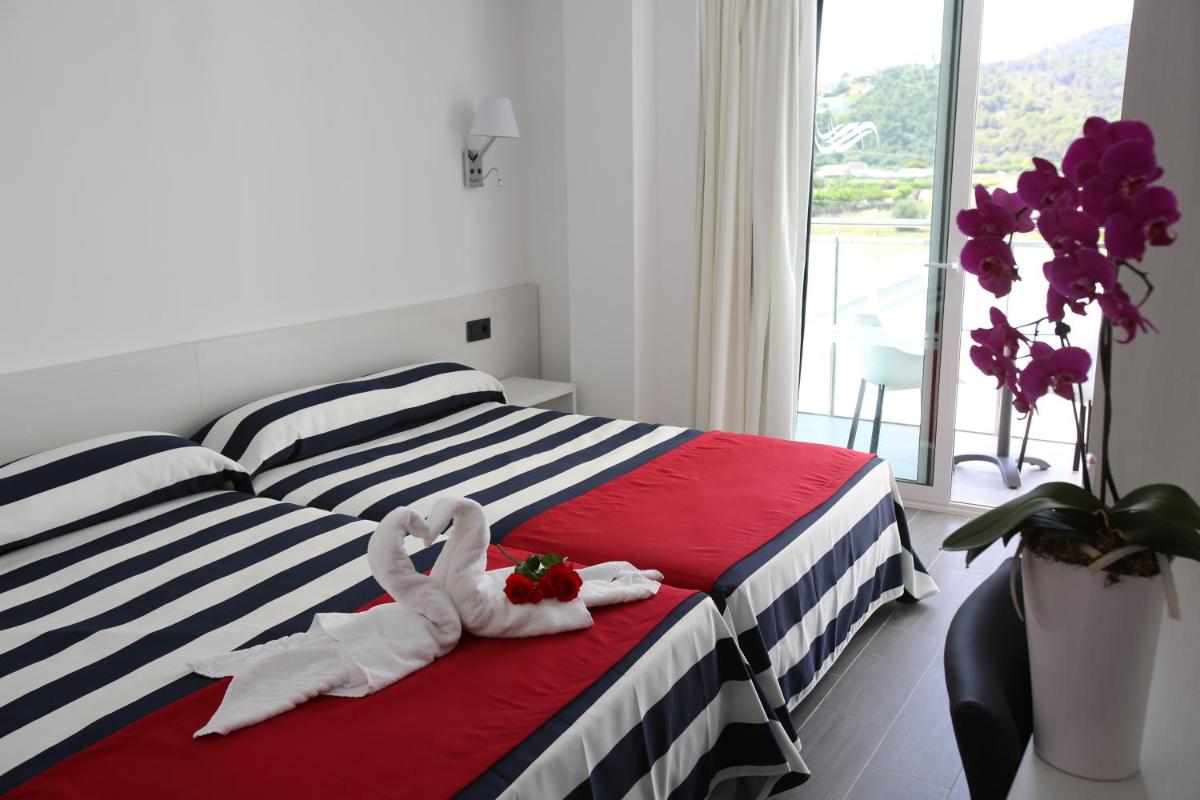 Cama o camas de una habitación en Hotel Europa Splash & Spa