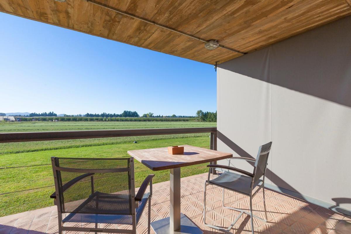 Un balcón o terraza de URH - Hotel Molí del Mig