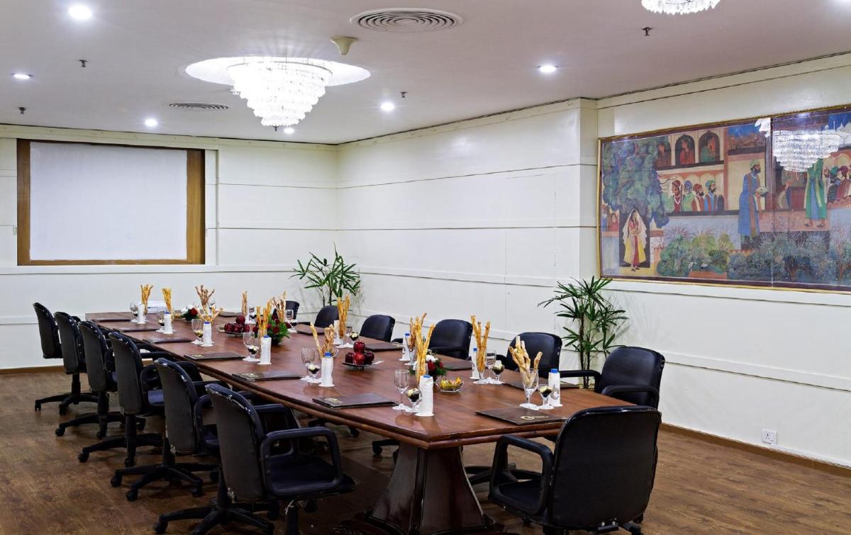a conference room with a long table and chairs at Clarks Avadh in Lucknow
