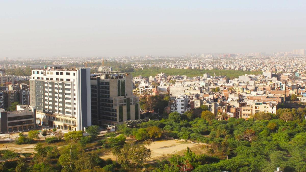 a view of a city with buildings and trees at Holiday Inn New Delhi Mayur Vihar Noida by IHG in New Delhi a view of a city with buildings and trees at Holiday Inn New Delhi Mayur Vihar Noida by IHG in New Delhi