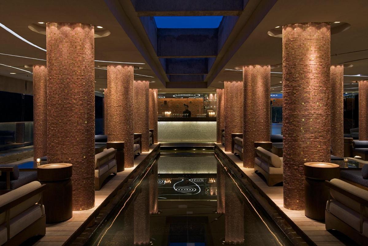 a pool in the middle of a hotel lobby at Vivanta Bengaluru, Whitefield in Bengaluru