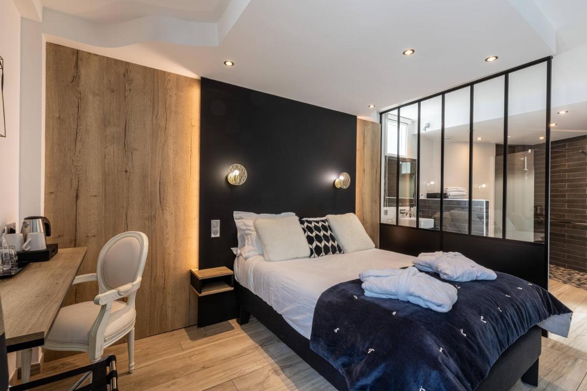 Un ou plusieurs lits dans un hébergement de l'établissement Le Bailliage Hôtel & Spa