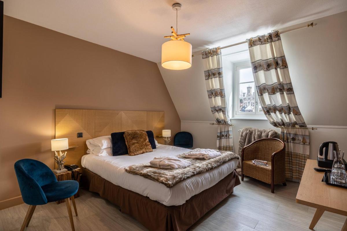 Un ou plusieurs lits dans un hébergement de l'établissement Le Bailliage Hôtel & Spa
