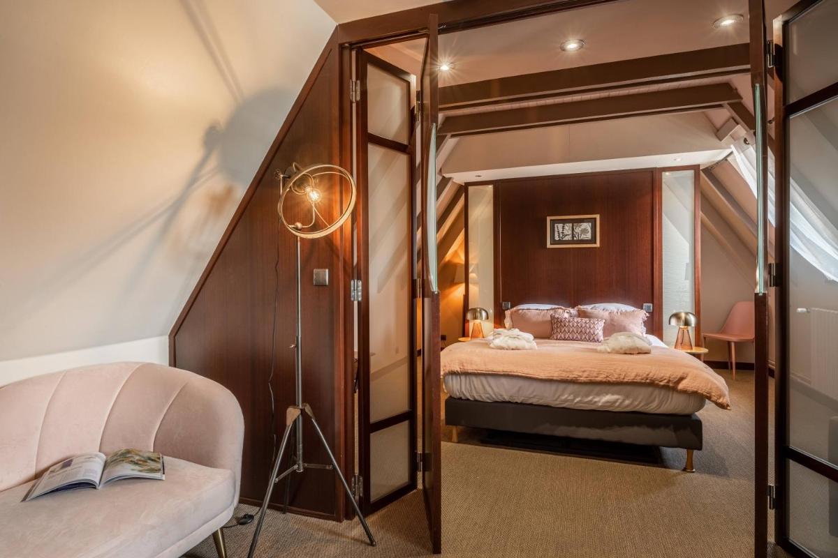 Un ou plusieurs lits dans un hébergement de l'établissement Le Bailliage Hôtel & Spa