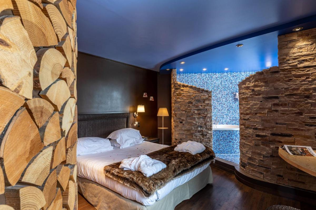 Un ou plusieurs lits dans un hébergement de l'établissement Le Bailliage Hôtel & Spa