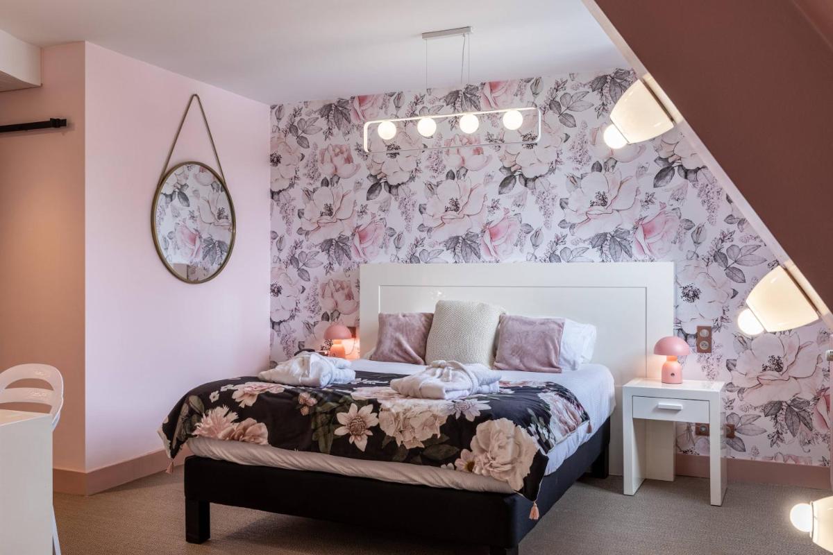 Un ou plusieurs lits dans un hébergement de l'établissement Le Bailliage Hôtel & Spa