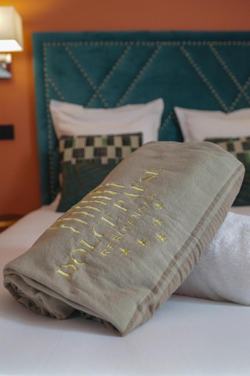 Un ou plusieurs lits dans un hébergement de l'établissement Eco-Résidence Dolce Paese & Spa