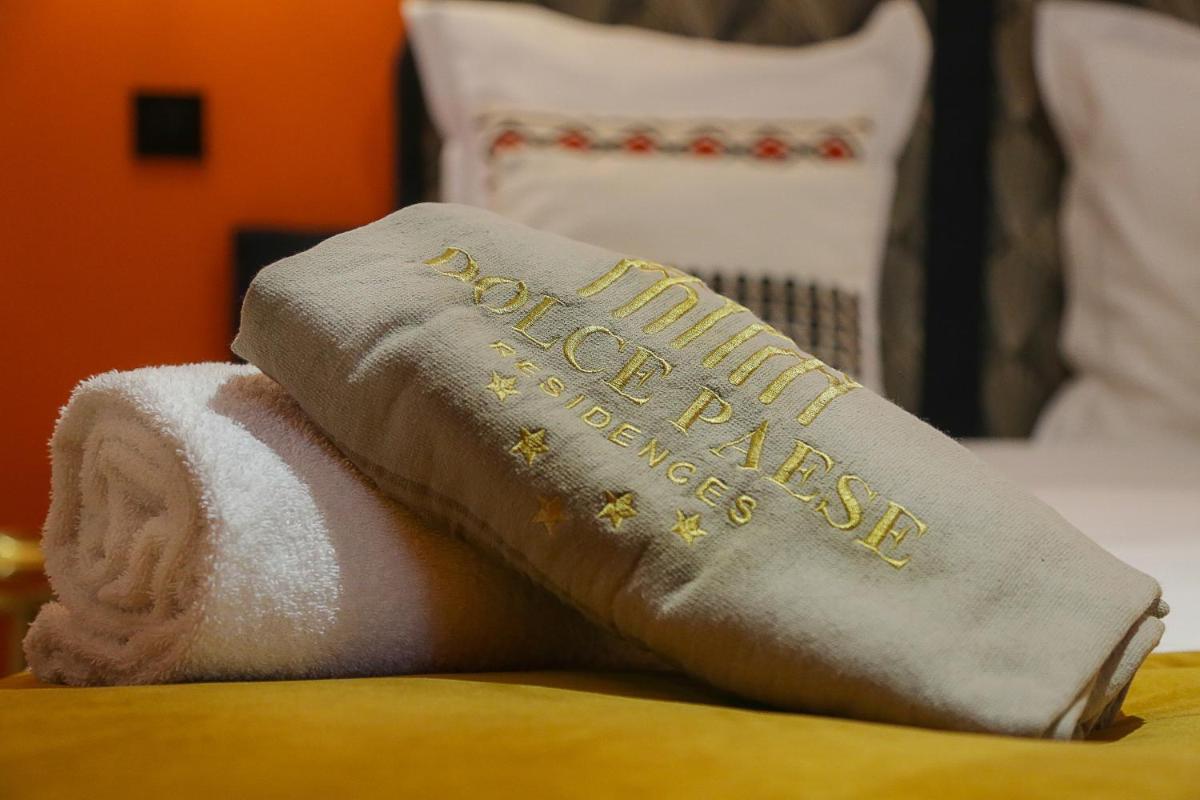 Un ou plusieurs lits dans un hébergement de l'établissement Eco-Résidence Dolce Paese & Spa