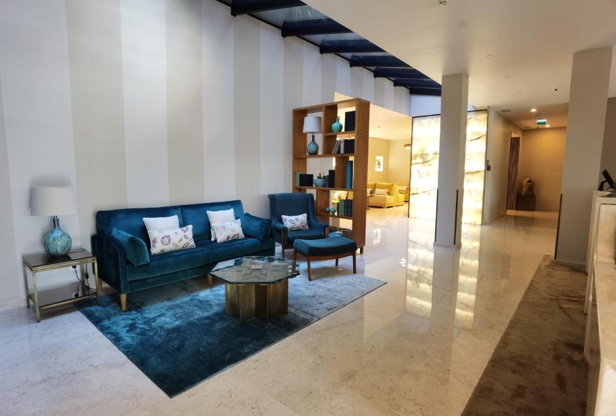 Uma área de estar em Castelo Hotel