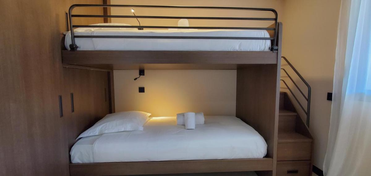 Un ou plusieurs lits dans un hébergement de l'établissement Eco-Résidence Dolce Paese & Spa