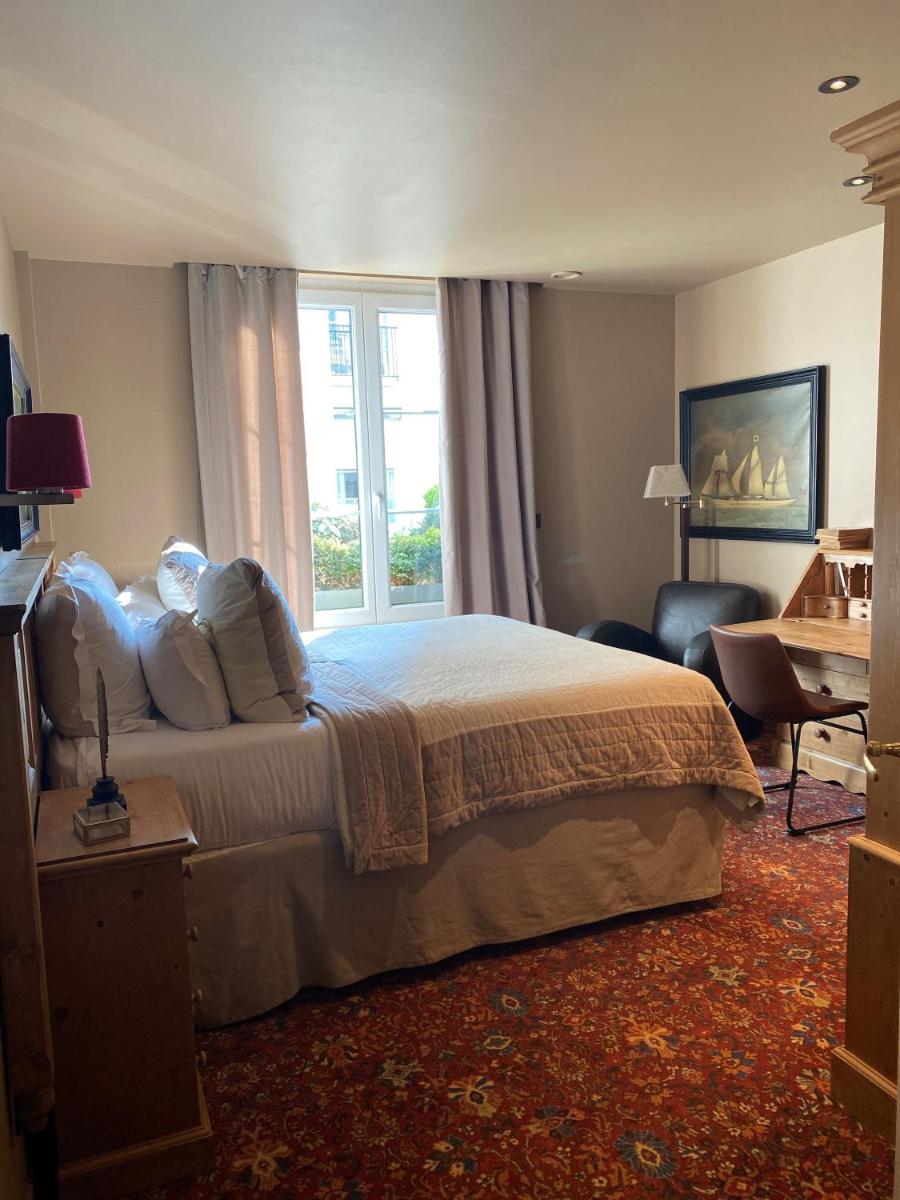 Un ou plusieurs lits dans un hébergement de l'établissement Hôtel Spa Vent d'Ouest