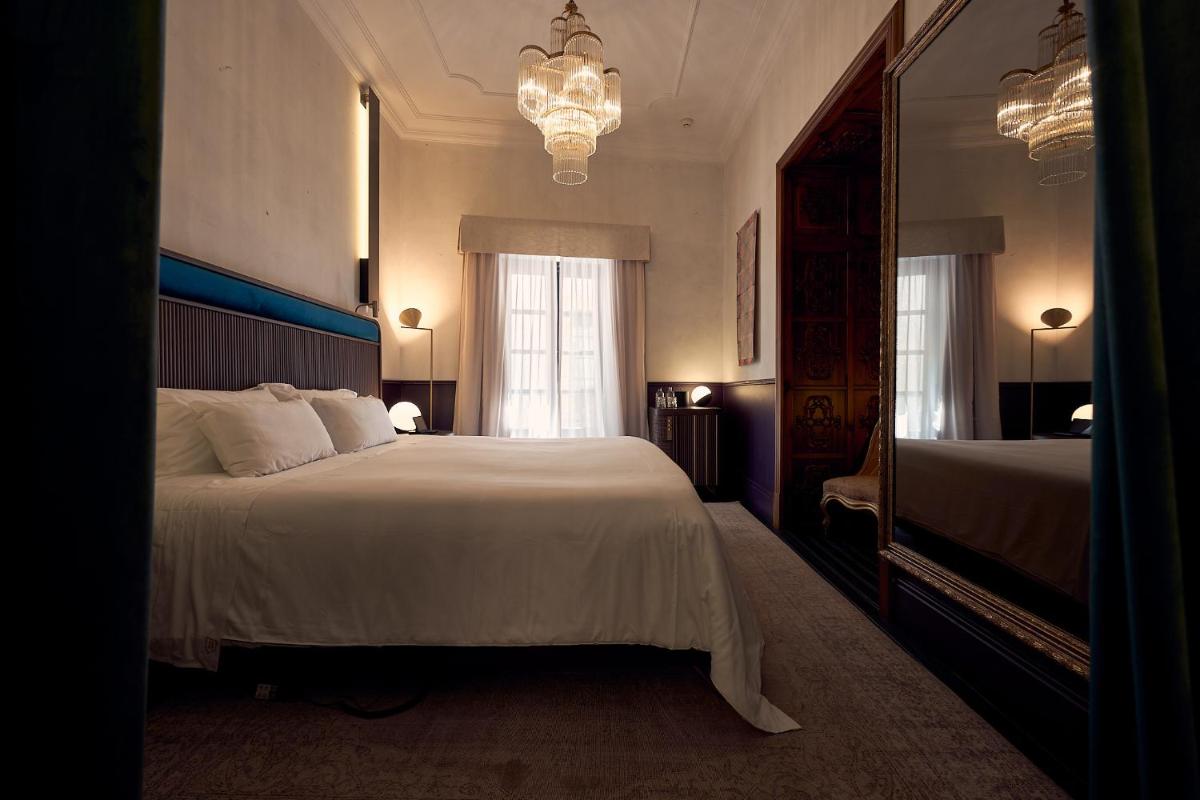 Cama o camas de una habitación en Can Bordoy Grand House Hotel GL Preferred Hotel