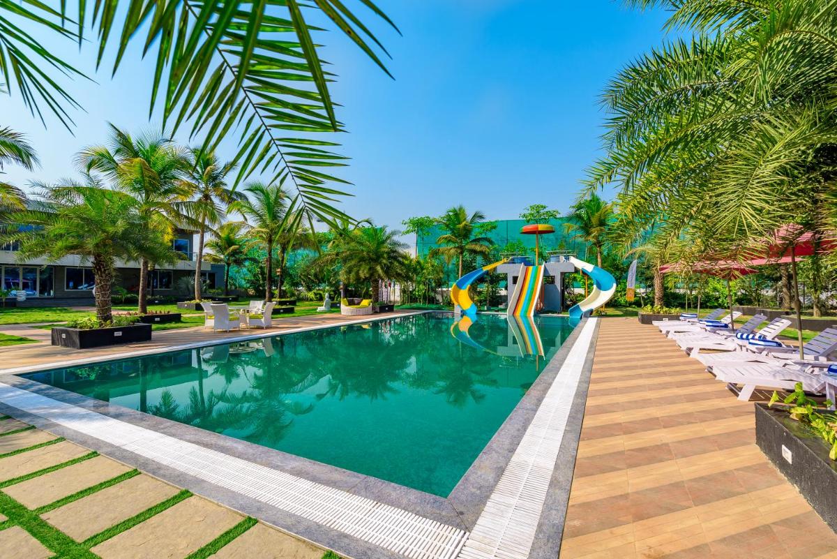 SaffronStays Palm Paradise, Kalyan Khadavli - swimming pool with water slides, gazebo and indoor games - Housity
