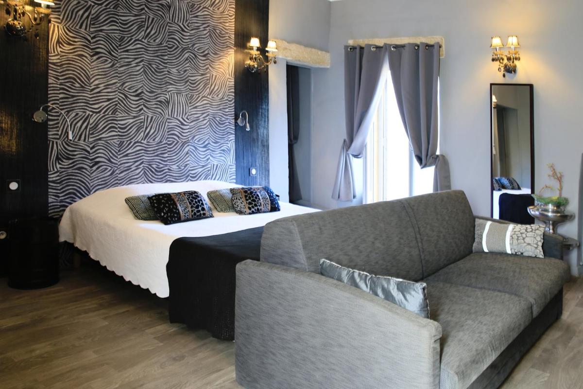 Un ou plusieurs lits dans un hébergement de l'établissement Le Castellas Hotel & SPA - TERITORIA