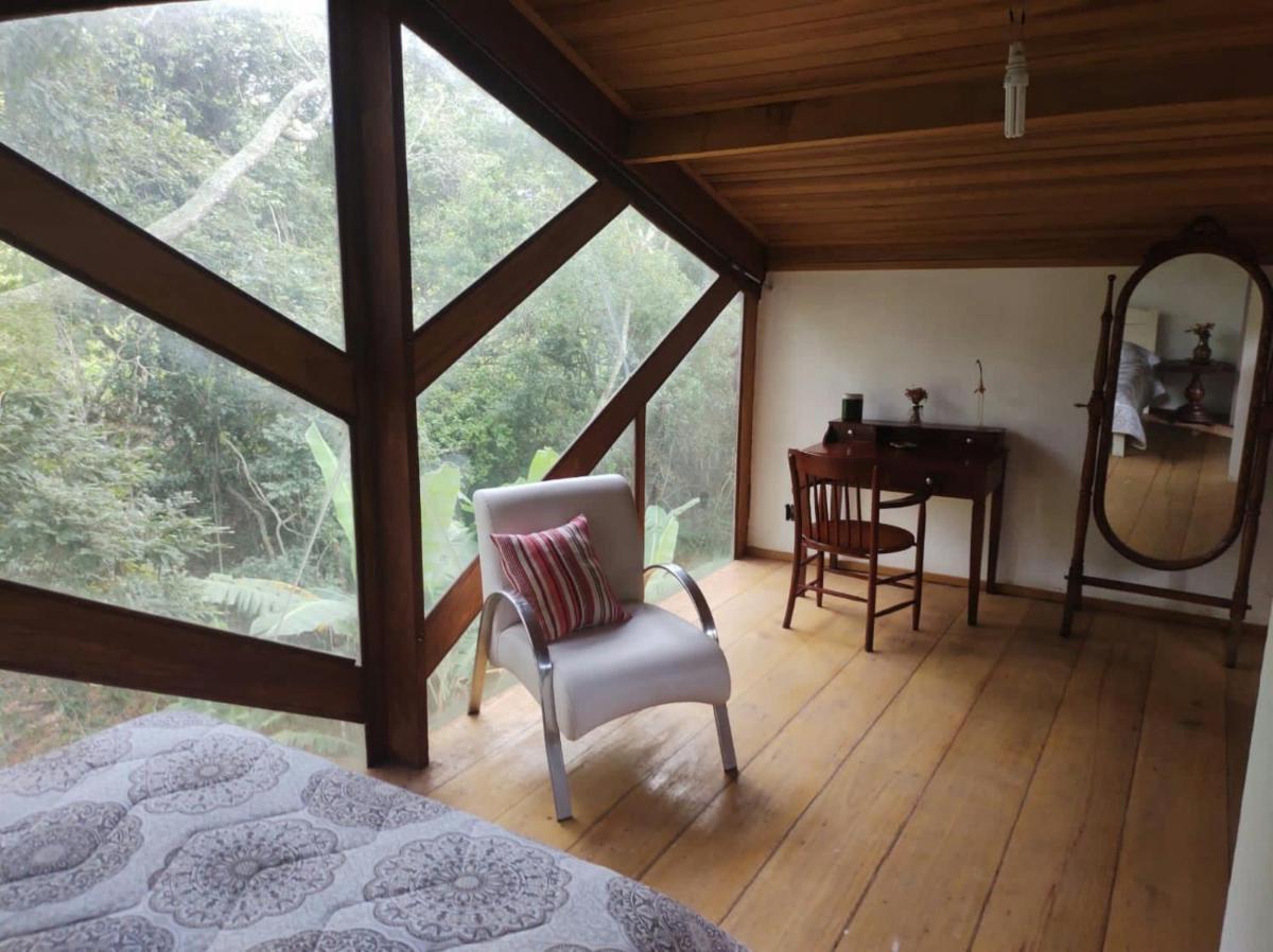 Chalé do bosque e cachoeirinha Passa Quatro - Housity