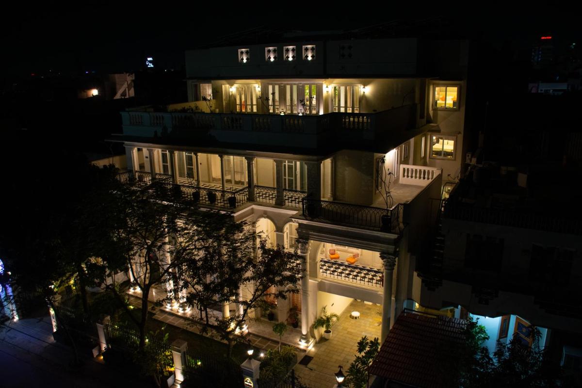 a large building with lights at night at Dileep Kothi - A Royal Boutique Luxury Suites in Jaipur in Jaipur
