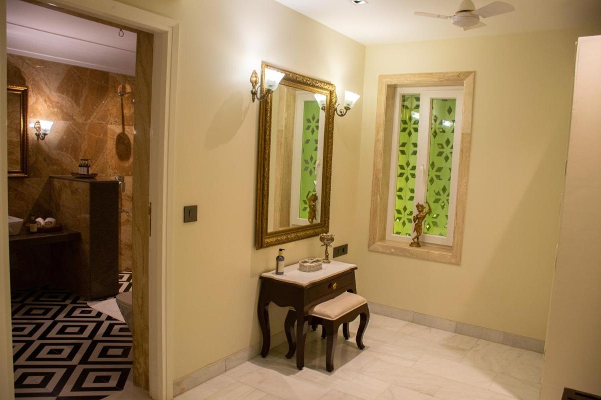 a bathroom with a sink and a mirror at Dileep Kothi - A Royal Boutique Luxury Suites in Jaipur in Jaipur