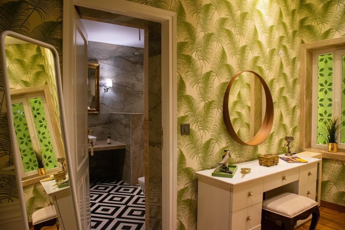 a bathroom with a sink and a mirror at Dileep Kothi - A Royal Boutique Luxury Suites in Jaipur in Jaipur