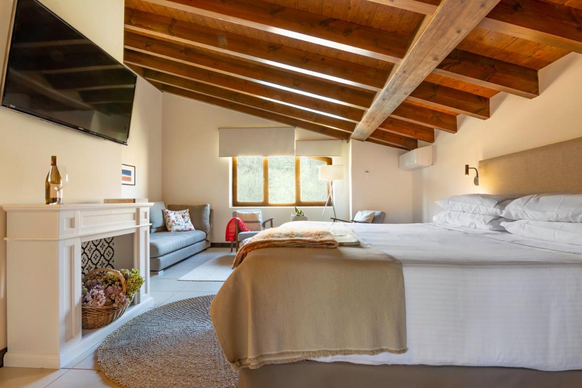 Cama o camas de una habitación en Molino de Alcuneza Relais & Châteaux