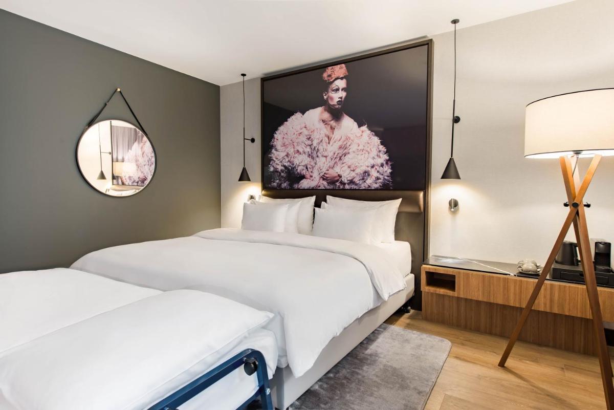 Ein Bett oder Betten in einem Zimmer der Unterkunft Radisson Collection Hotel, Berlin