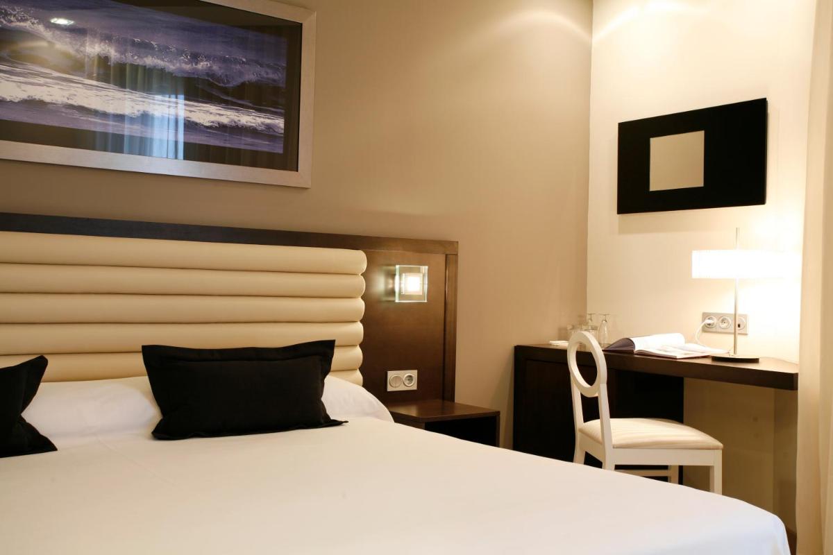 Cama o camas de una habitación en Hotel Bienestar Moaña