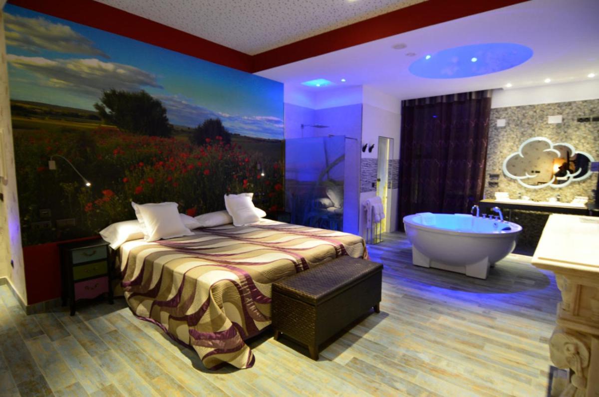 Cama o camas de una habitación en Hotel SPA El Lagar de Isilla