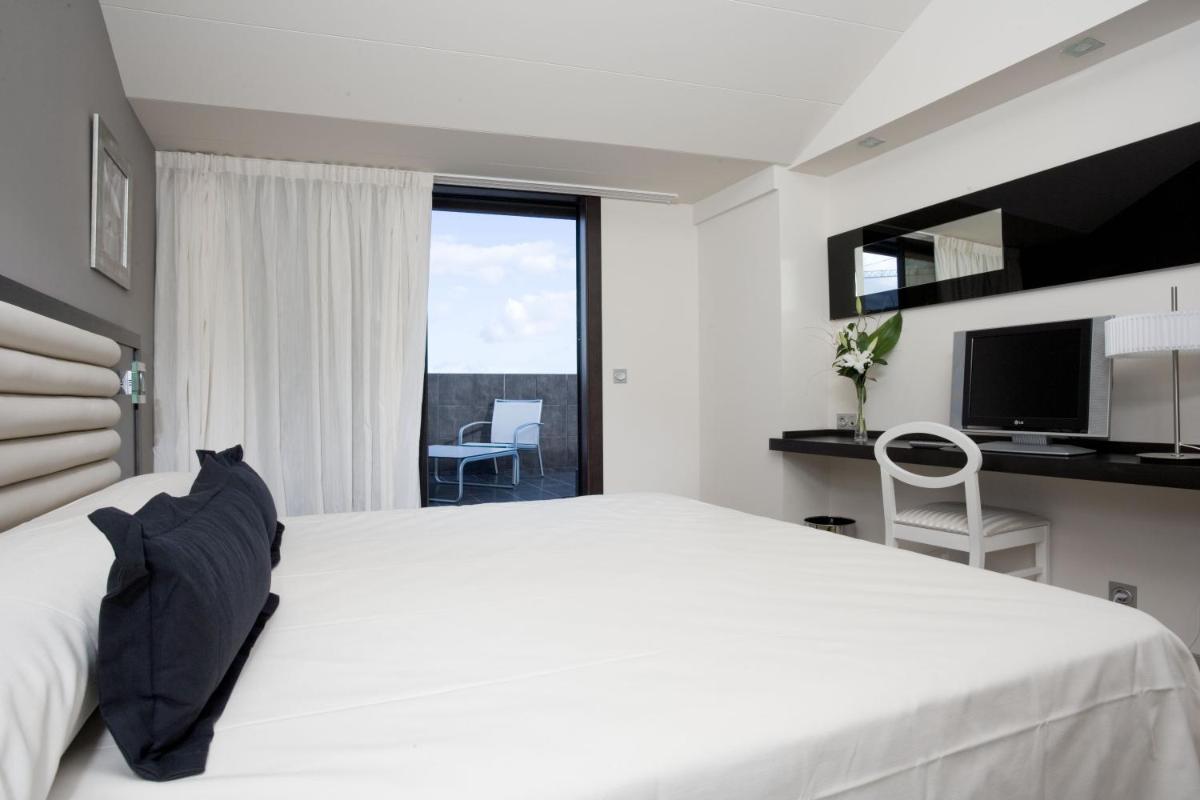 Cama o camas de una habitación en Hotel Bienestar Moaña