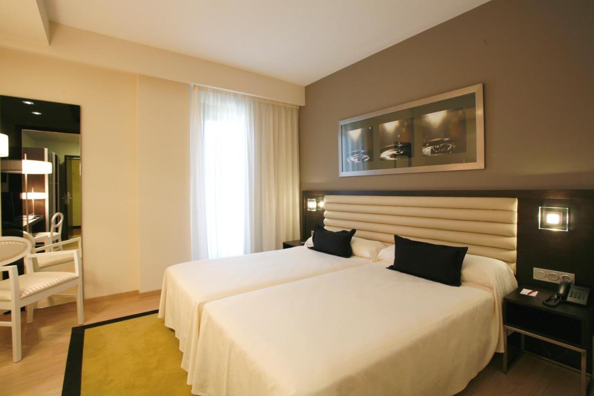 Cama o camas de una habitación en Hotel Bienestar Moaña