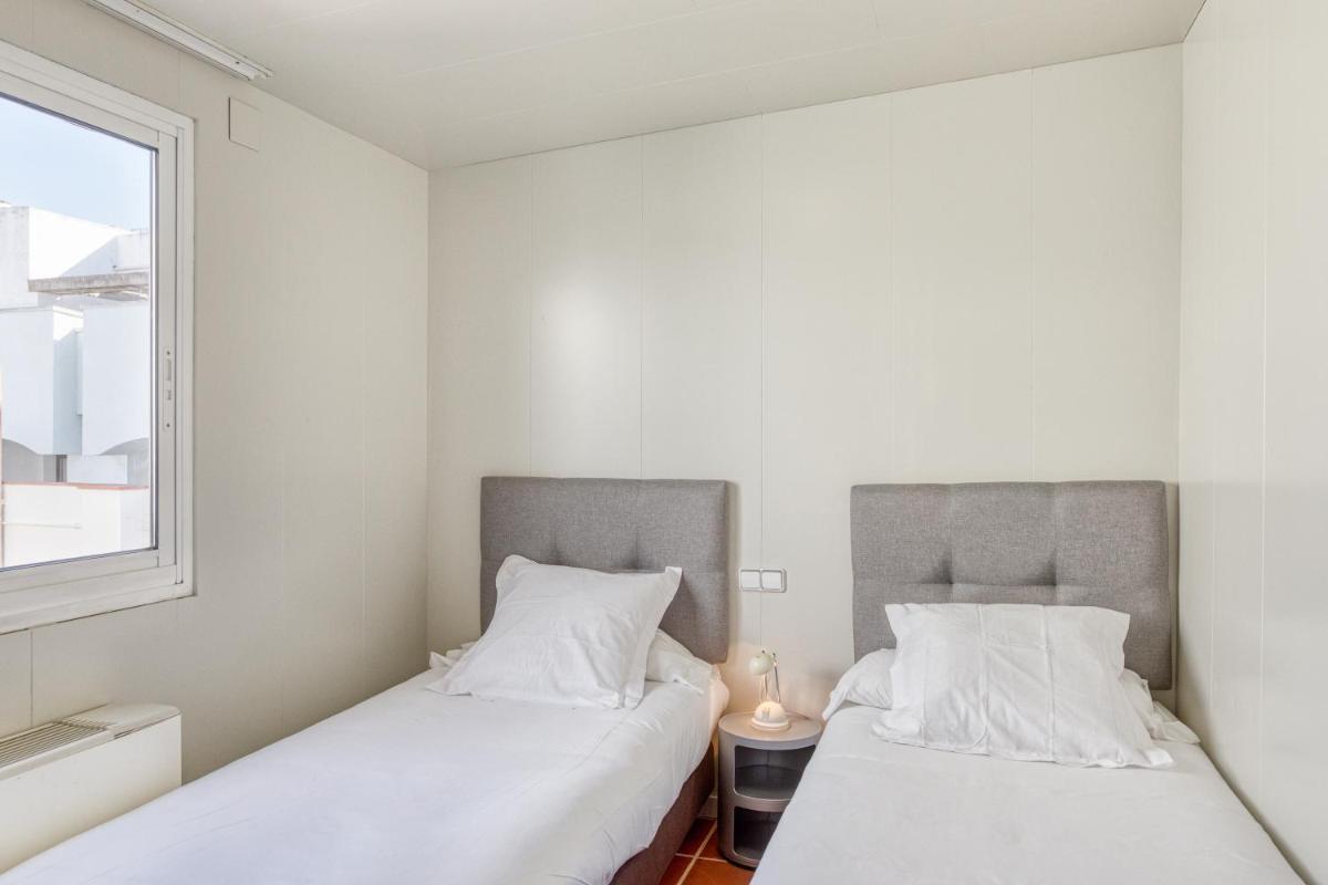 Cama o camas de una habitación en Hotel Marina