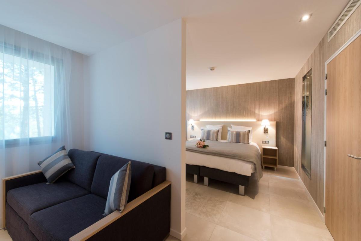 Un ou plusieurs lits dans un hébergement de l'établissement Golden Tulip Sophia Antipolis - Hotel & Spa