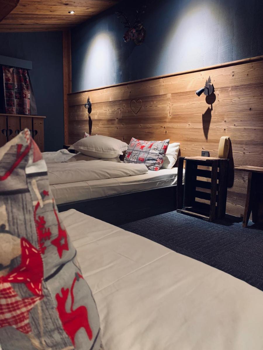 Un ou plusieurs lits dans un hébergement de l'établissement Chalet Hôtel & Spa Le Collet