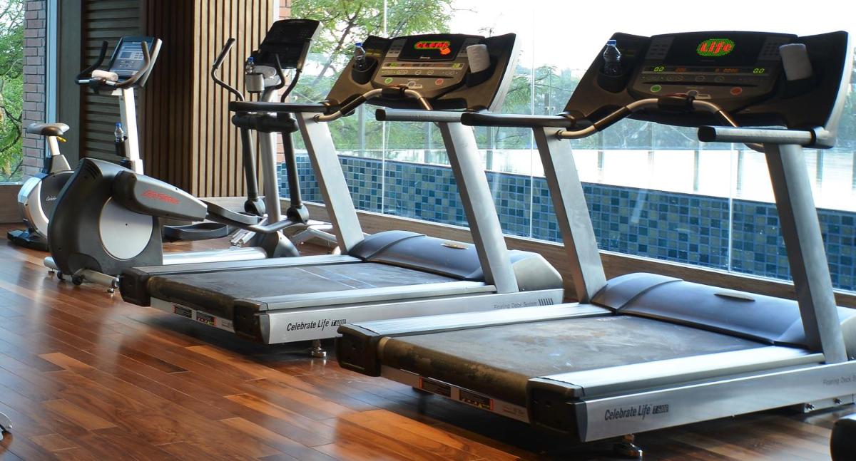a row of cardio machines in a gym at Welcomhotel by ITC Hotels, Richmond Road, Bengaluru in Bengaluru