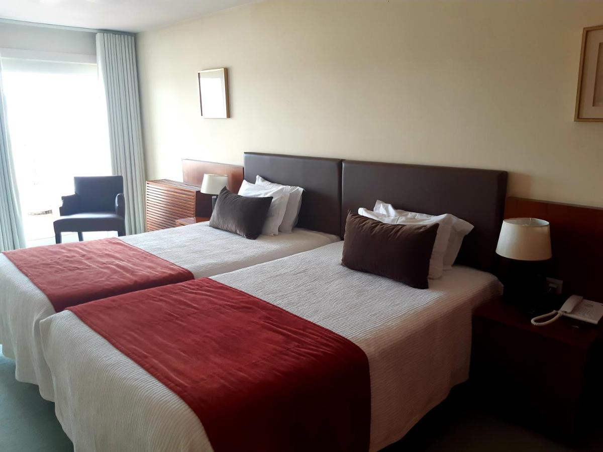 Uma cama ou camas num quarto em Santana Hotel & SPA