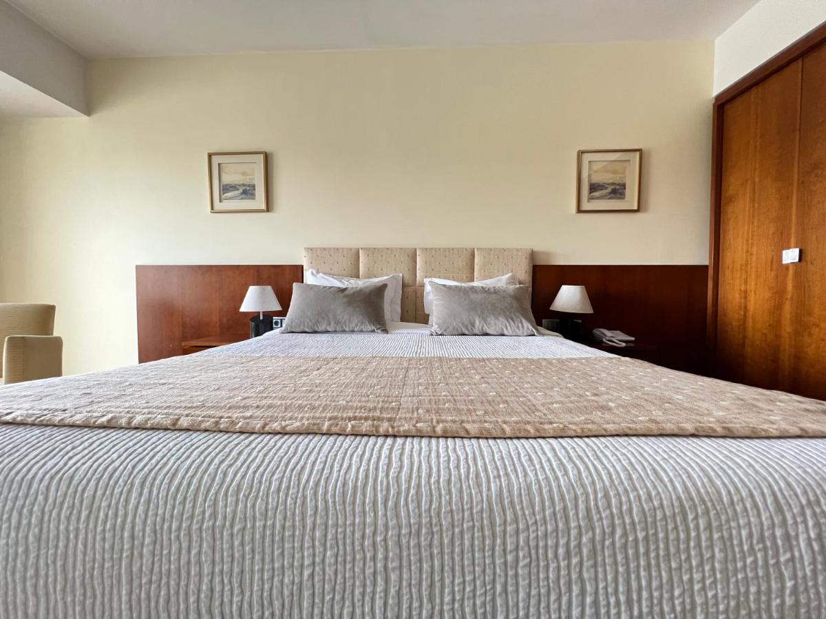 Uma cama ou camas num quarto em Santana Hotel & SPA