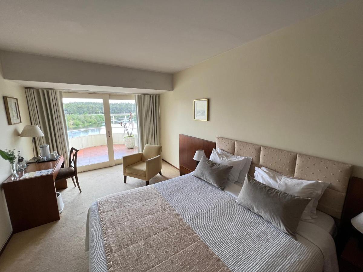Uma cama ou camas num quarto em Santana Hotel & SPA