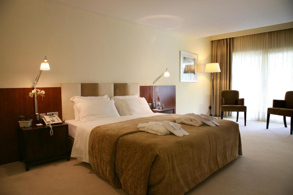 Uma cama ou camas num quarto em Santana Hotel & SPA