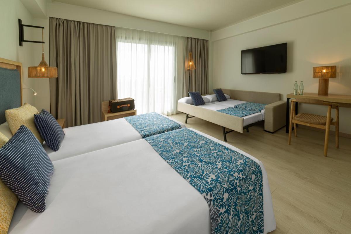Cama o camas de una habitación en Hotel Cabogata Jardín