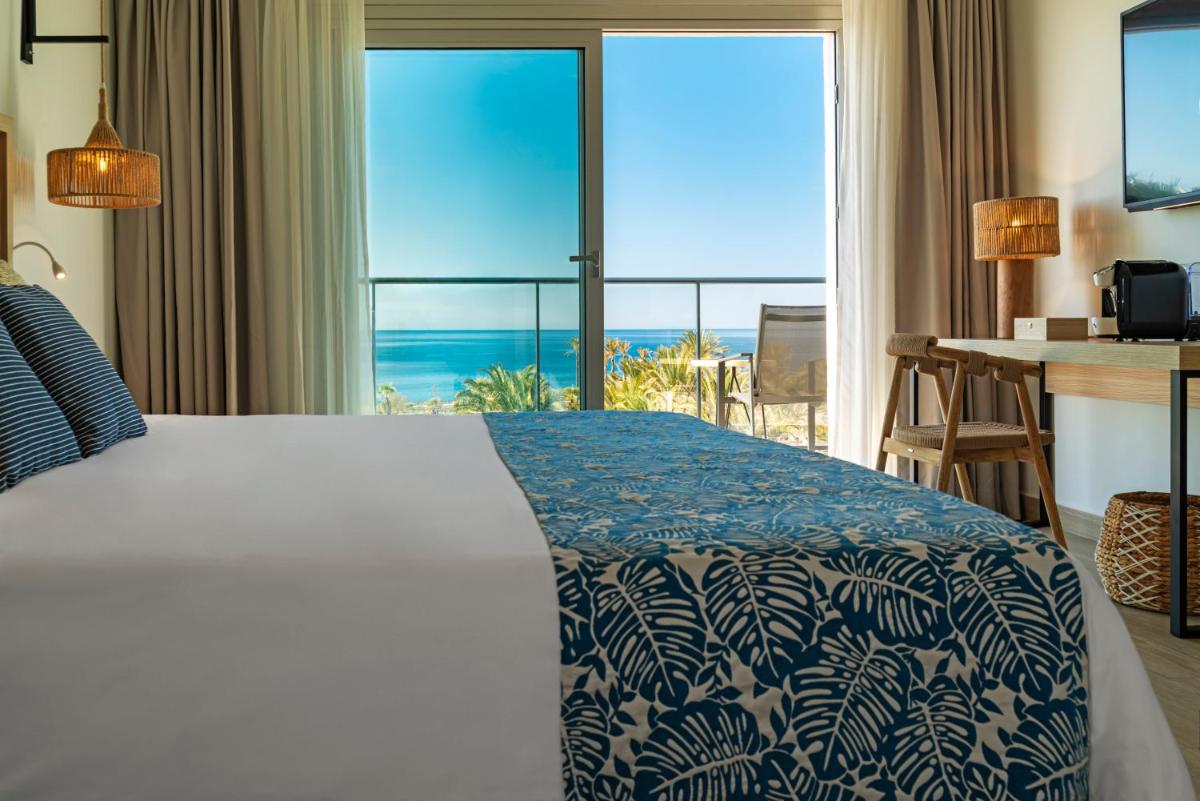Cama o camas de una habitación en Hotel Cabogata Jardín