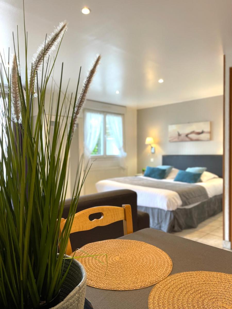 Un ou plusieurs lits dans un hébergement de l'établissement La Maison Blanche