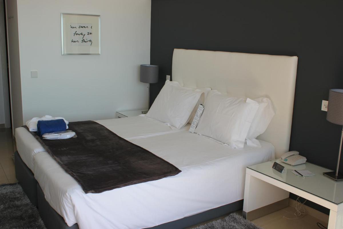 Uma cama ou camas num quarto em Rocamar Exclusive Hotel & Spa - Adults Only