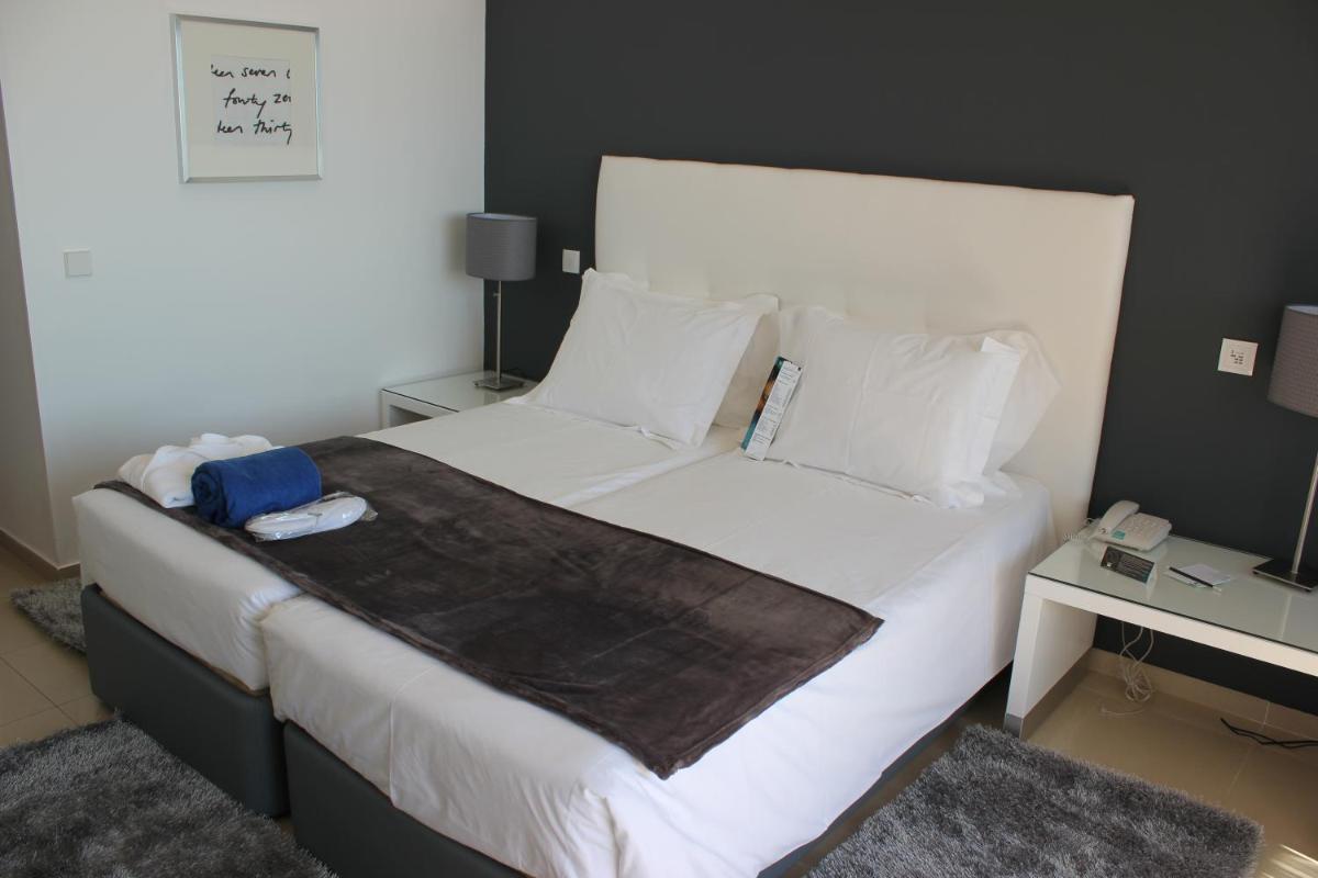 Uma cama ou camas num quarto em Rocamar Exclusive Hotel & Spa - Adults Only