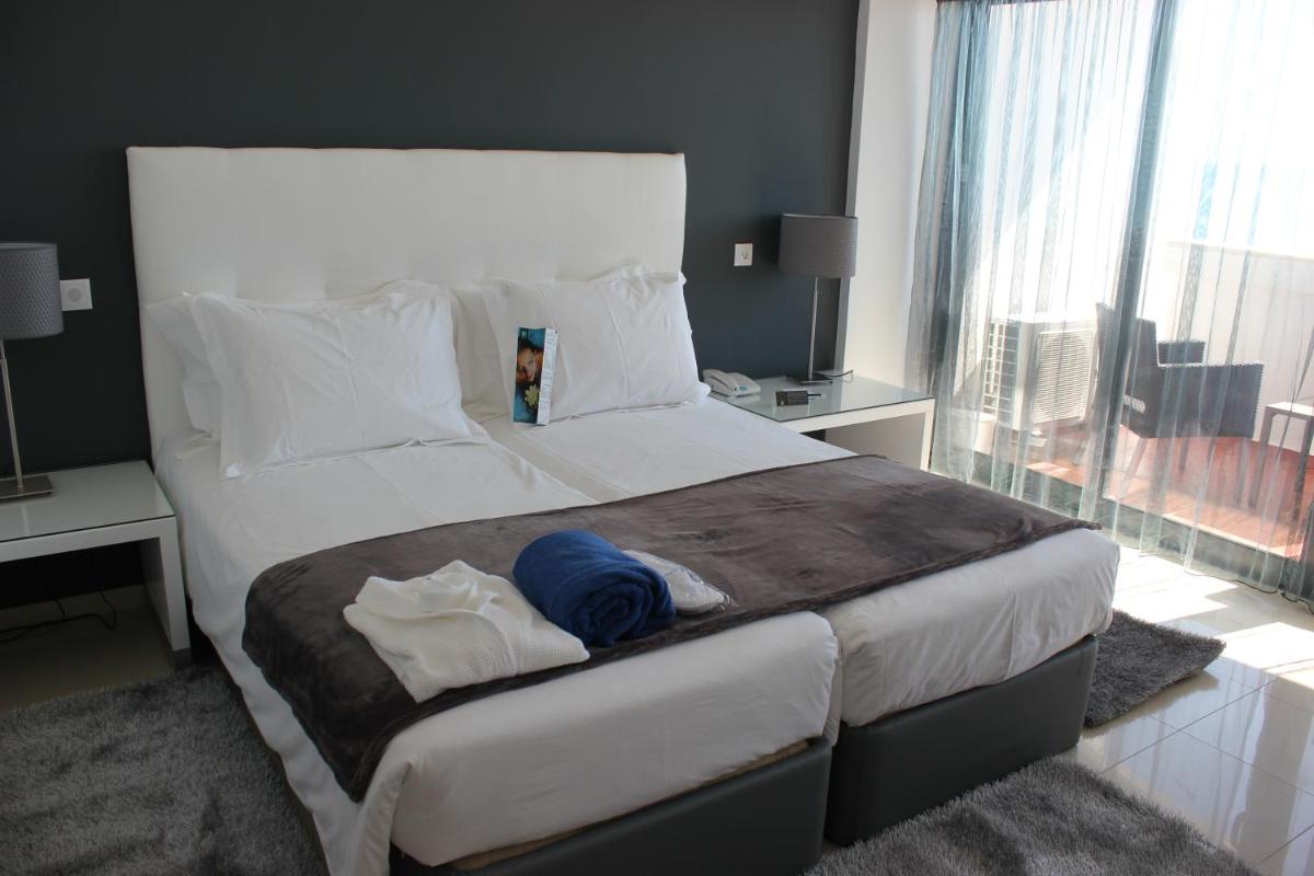 Uma cama ou camas num quarto em Rocamar Exclusive Hotel & Spa - Adults Only