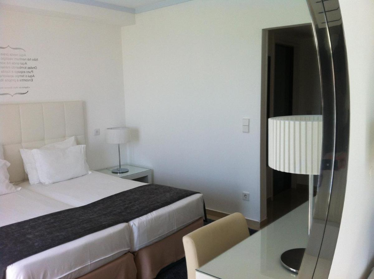 Uma cama ou camas num quarto em Rocamar Exclusive Hotel & Spa - Adults Only