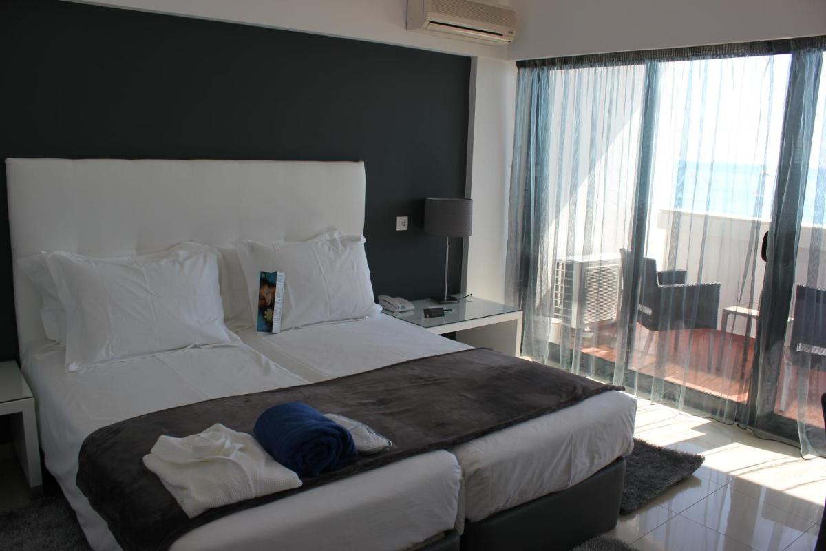 Uma cama ou camas num quarto em Rocamar Exclusive Hotel & Spa - Adults Only