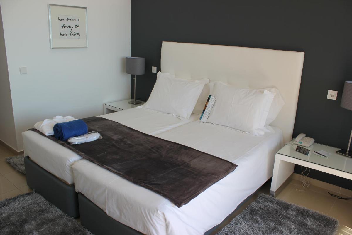 Uma cama ou camas num quarto em Rocamar Exclusive Hotel & Spa - Adults Only